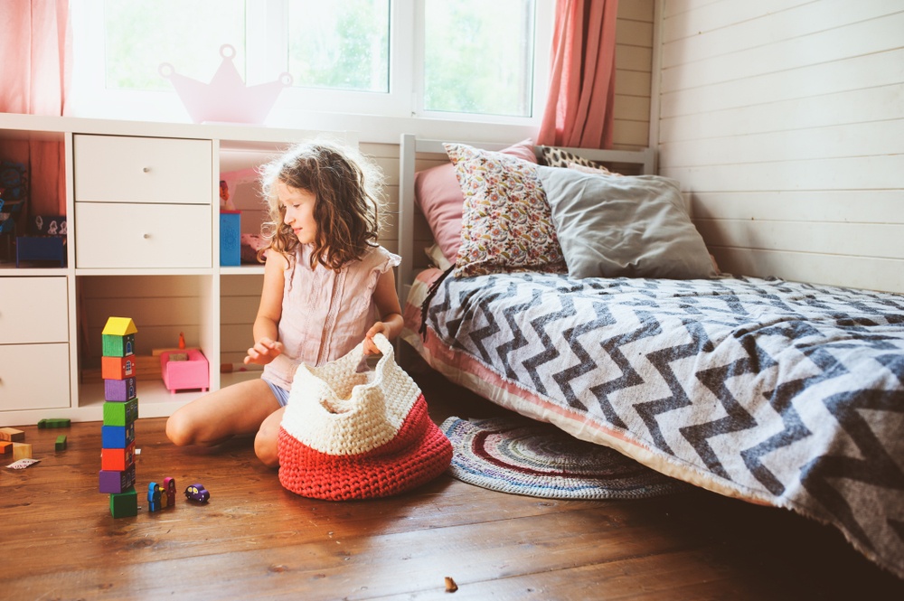 Young girl organizing bedroom in Scottsdale, AZ