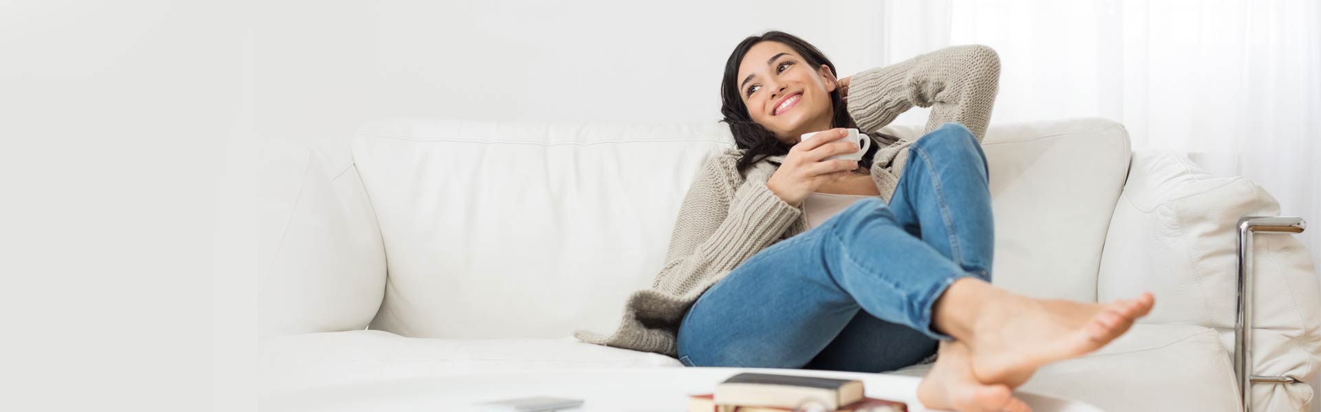 Woman relaxing in her clean, organized home