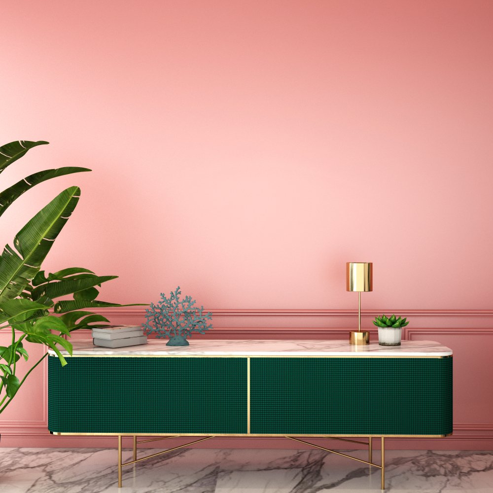 Colorful interior design for a living area with a pink wall and green credenza.